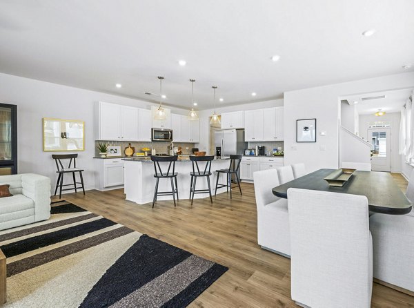 Elegant living room featuring modern furnishings and large windows at Affinity at Kendrick Apartments, Greystar luxury apartments