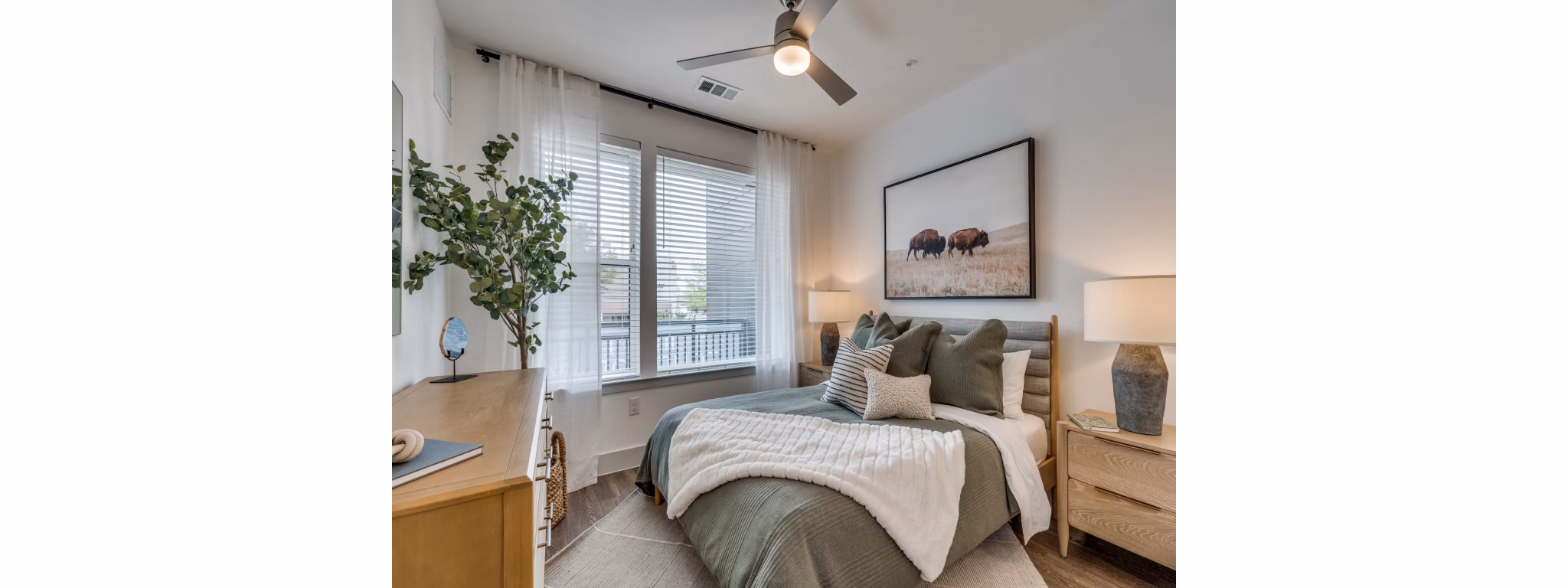 Bedroom with contemporary decor at The Met Apartments
