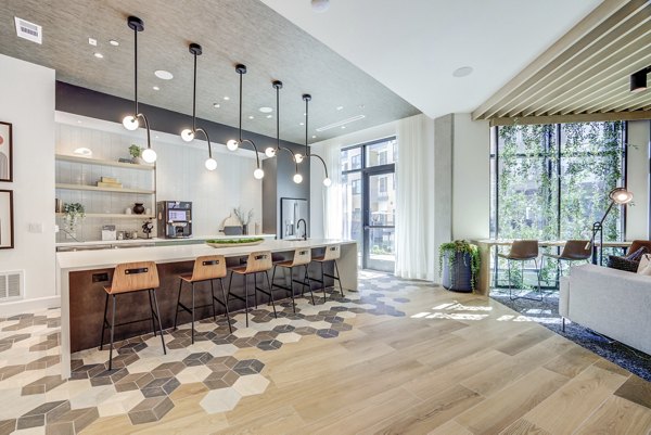 The Met Apartments: Elegant living room with contemporary decor and ample natural light