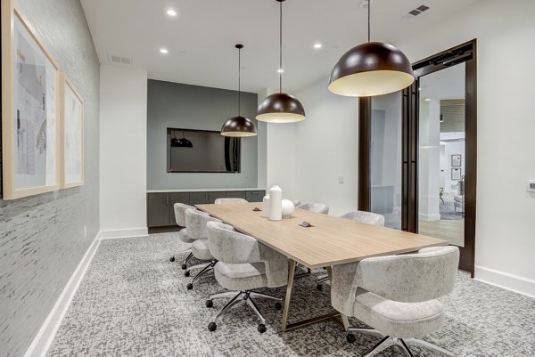 Spacious meeting facility with modern amenities at The Met Apartments, ideal for business gatherings and events in a luxury setting