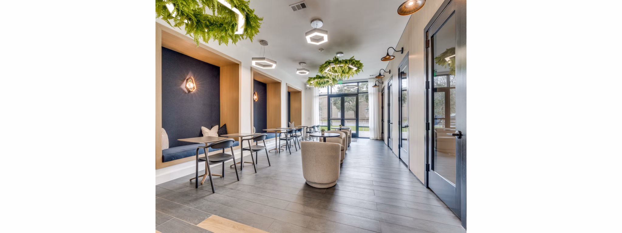 The Met Apartments: Stylish clubhouse featuring modern furnishings and open layout, perfect for gatherings