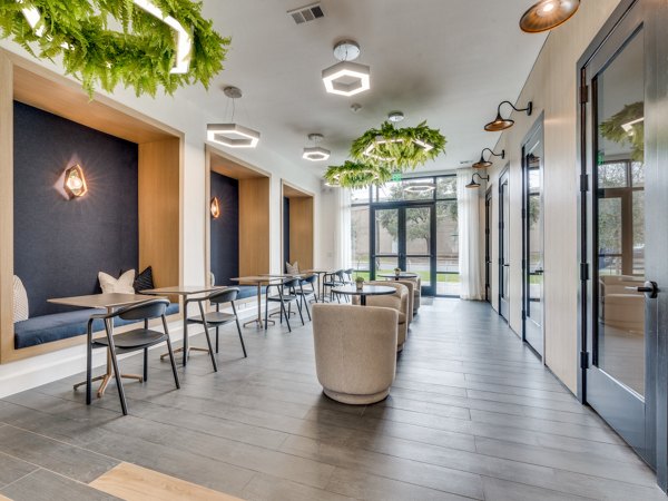 The Met Apartments: Stylish clubhouse featuring modern furnishings and open layout, perfect for gatherings