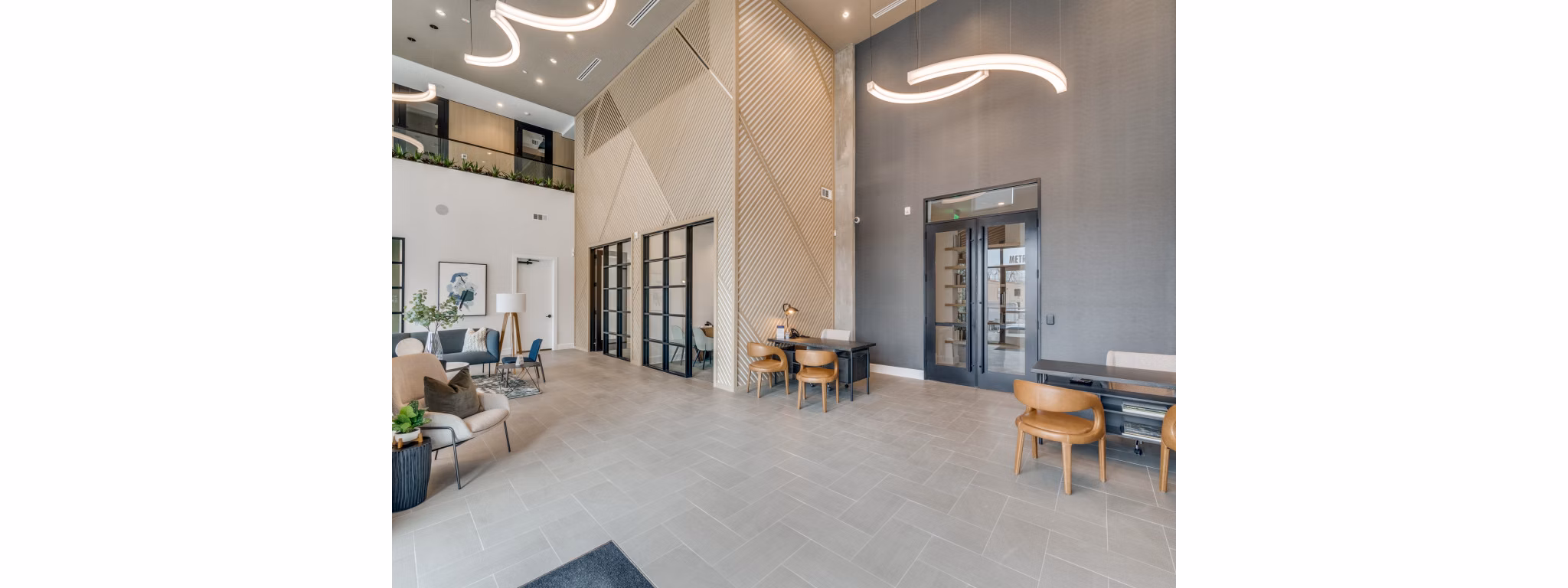 Clubhouse with luxury furnishings and spacious seating at The Met Apartments