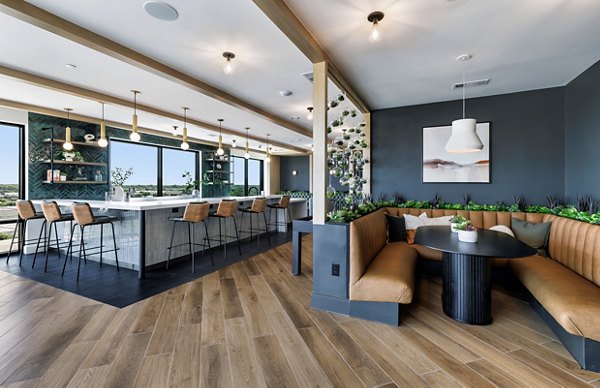 Clubhouse with contemporary design and cozy seating at DASH Downers Grove Apartments, highlighting luxury amenities for residents