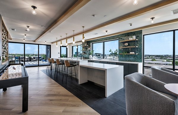 Elegant clubhouse with modern design at DASH Downers Grove Apartments featuring luxurious seating and decor