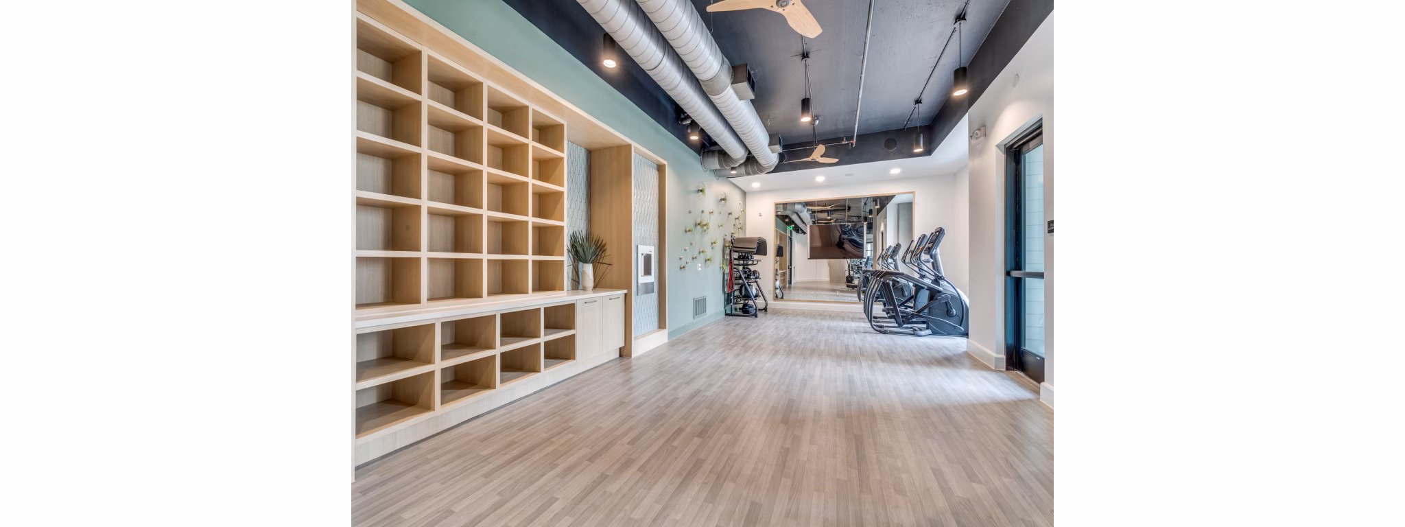 Yoga and spin studio with modern equipment at The Met Apartments
