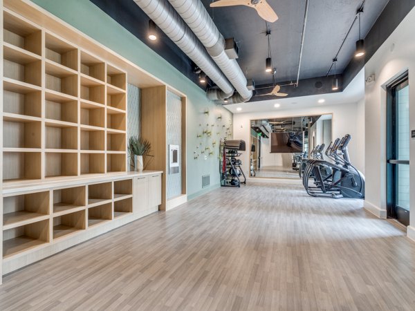 Yoga and spin studio with modern equipment at The Met Apartments