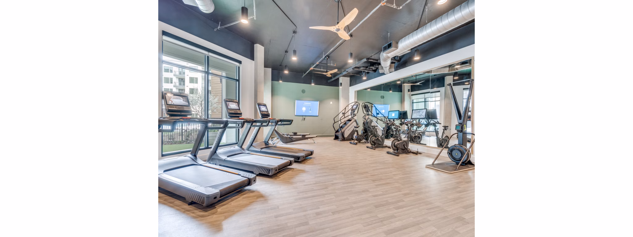 State-of-the-art fitness center with modern equipment at The Met Apartments