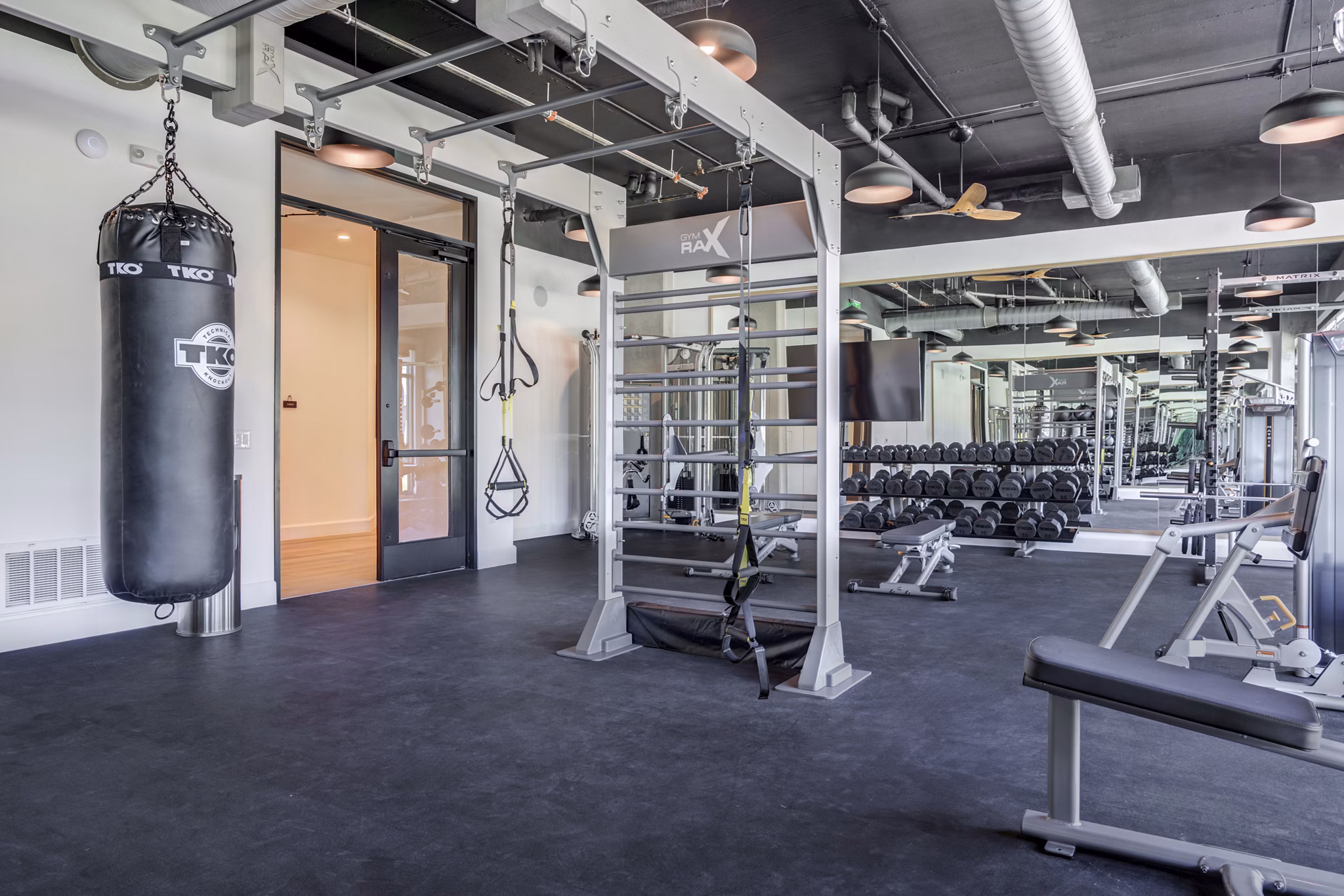 State-of-the-art fitness center with modern equipment at The Met Apartments