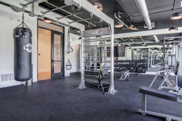 State-of-the-art fitness center with modern equipment at The Met Apartments