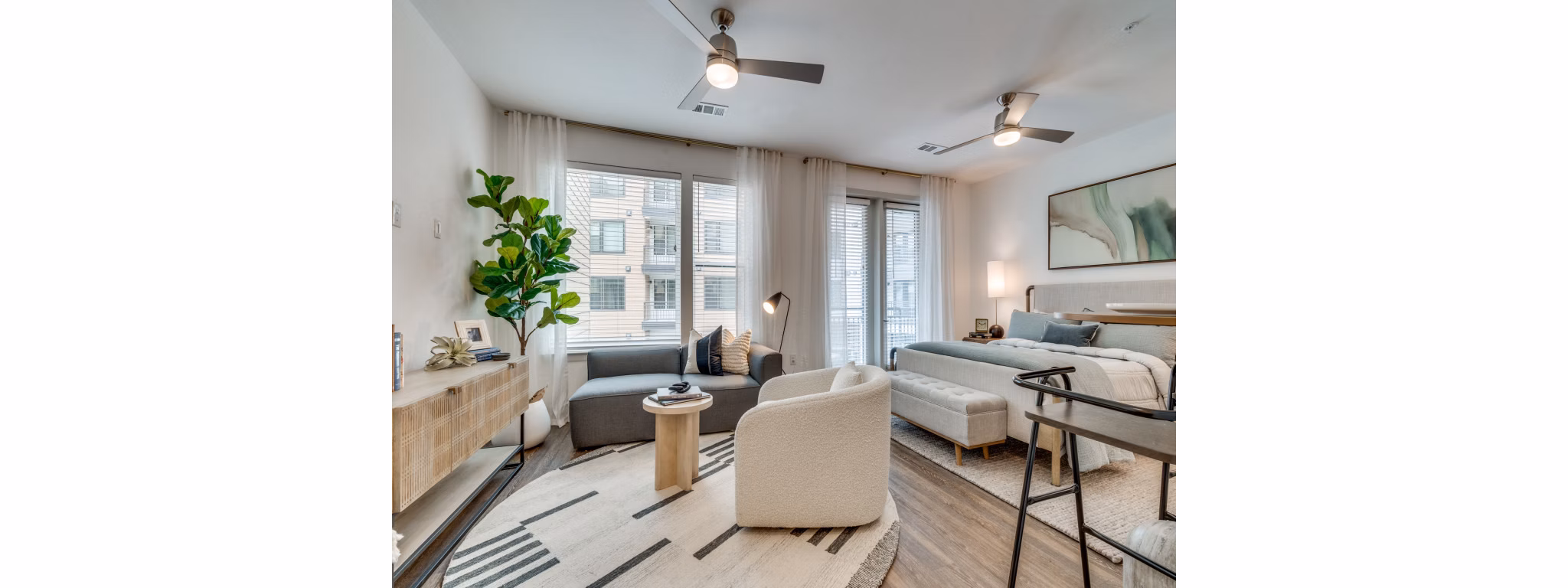 Open-concept kitchen with stainless steel appliances at The Met Apartments