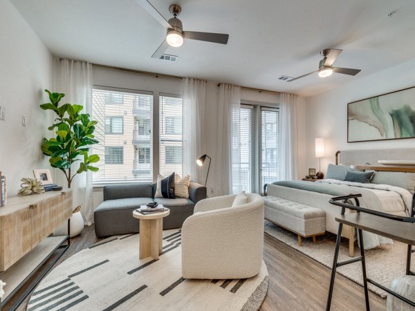 Open-concept kitchen with stainless steel appliances at The Met Apartments