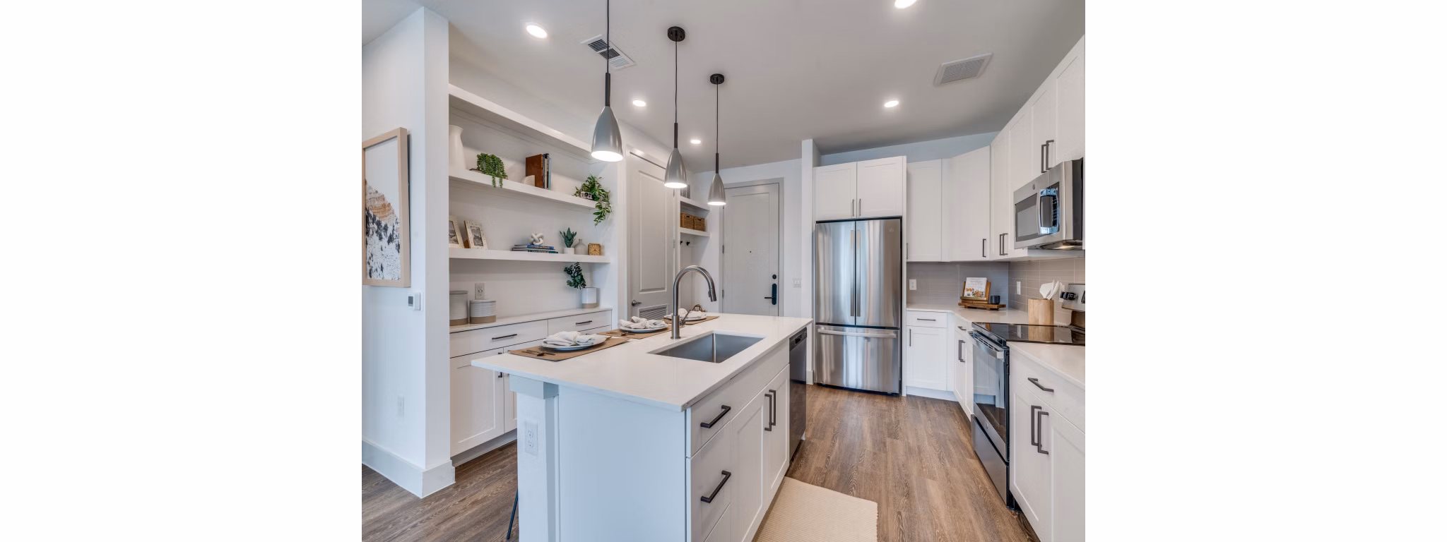 The Met Apartments: Modern kitchen with stainless steel appliances and granite countertops