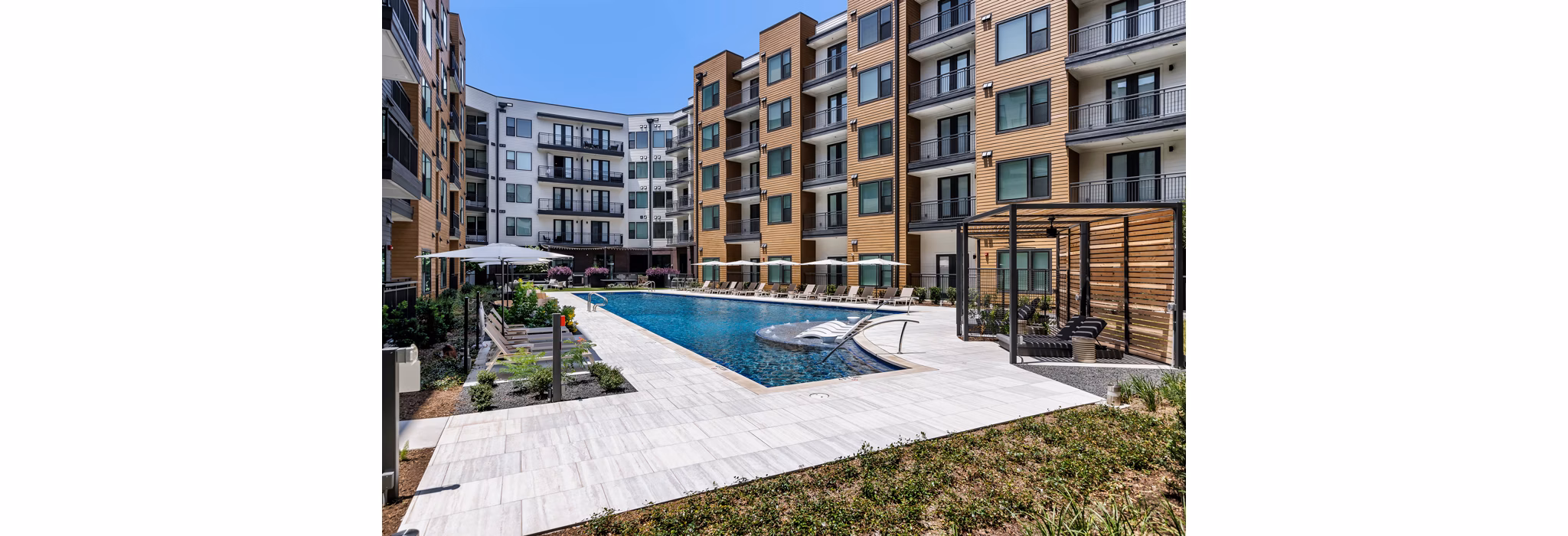 Rooftop pool offering stunning city views at The Met Apartments
