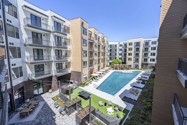 Luxurious poolside lounge at The Met Apartments, offering relaxation and stunning views in a premier luxury apartment community