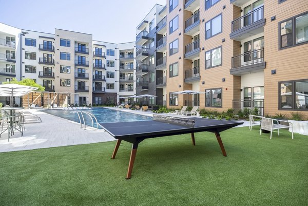 Spacious courtyard featuring lush greenery at The Met Apartments in a luxury setting