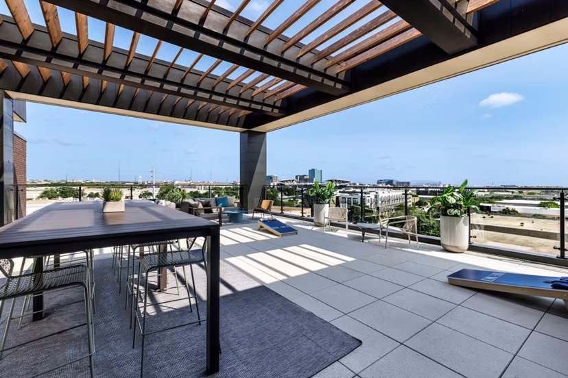 Scenic rooftop deck with lounge seating at The Met Apartments offering luxury living in a vibrant community