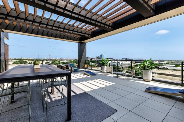 Scenic rooftop deck with lounge seating at The Met Apartments offering luxury living in a vibrant community