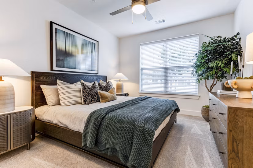 Cozy bedroom with modern furnishings at Marion Lake Apartments