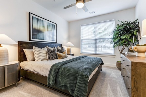 Cozy bedroom with modern furnishings at Marion Lake Apartments