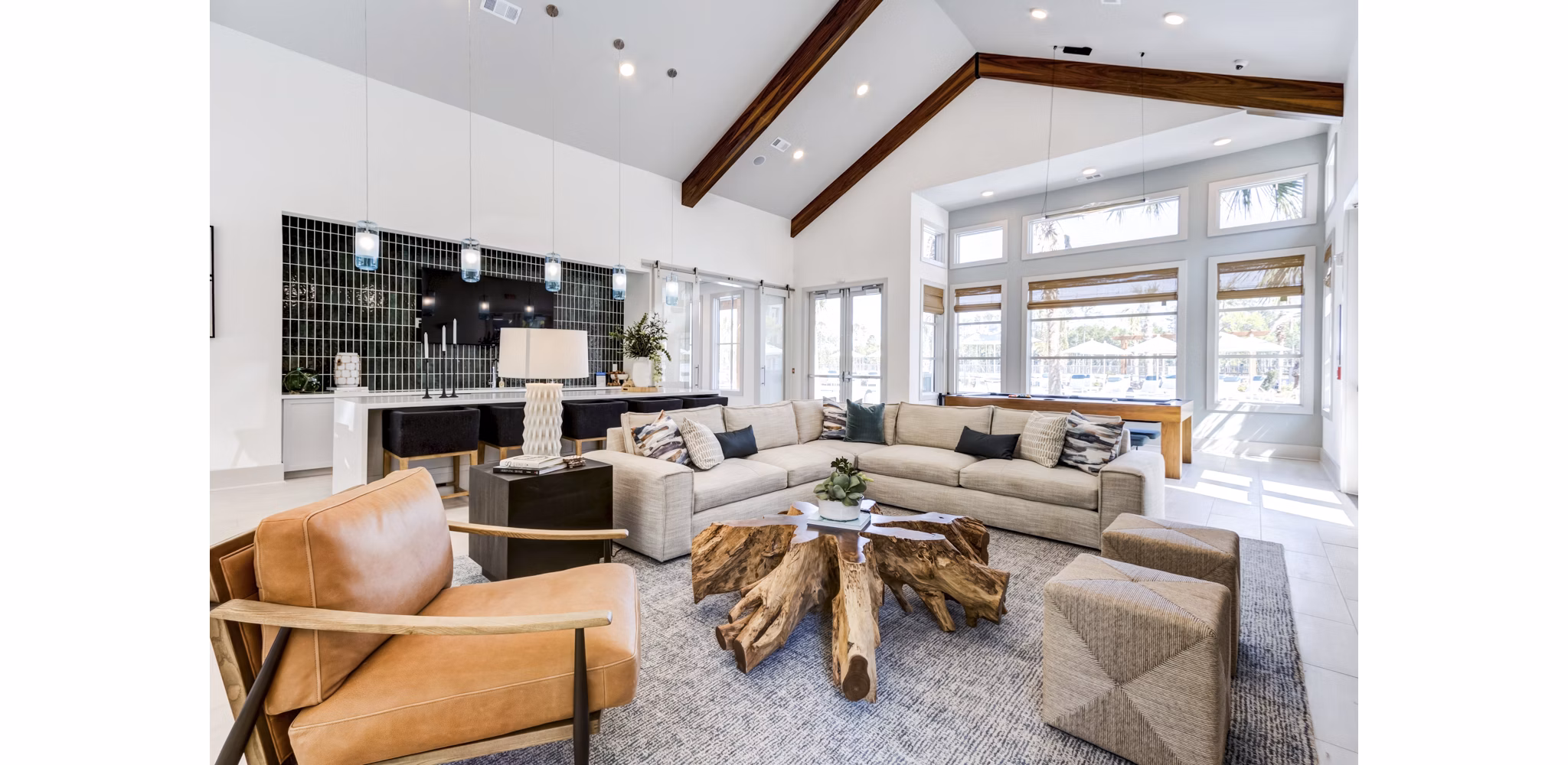 Clubhouse featuring modern lounge seating and billiards table at Marion Lake Apartments