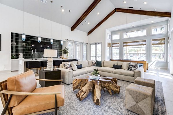 Clubhouse featuring modern lounge seating and billiards table at Marion Lake Apartments