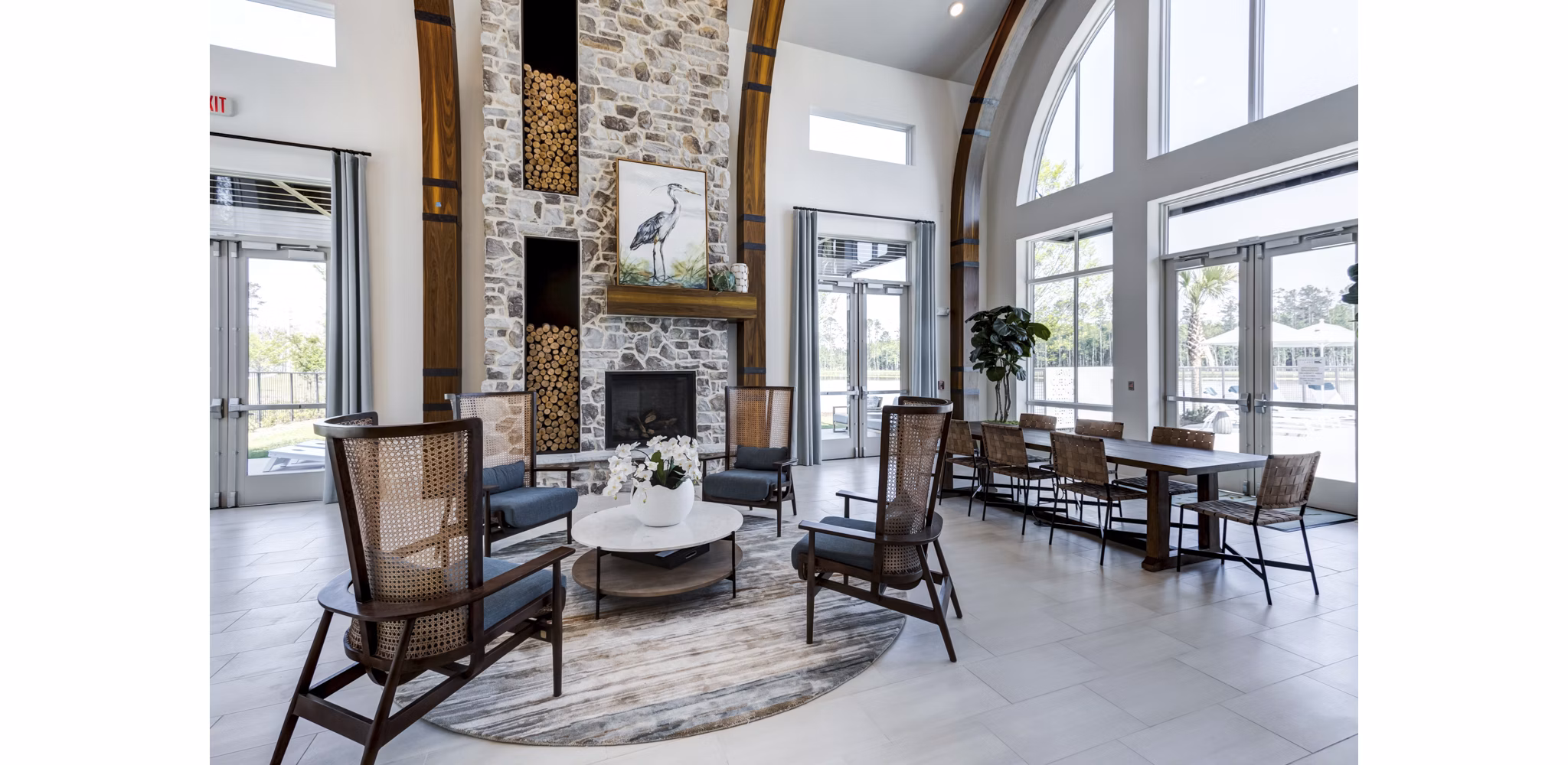 Clubhouse at Marion Lake Apartments: Spacious and modern design with comfortable seating and large windows offering scenic views