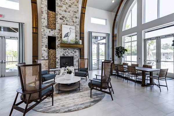 Clubhouse at Marion Lake Apartments: Spacious and modern design with comfortable seating and large windows offering scenic views
