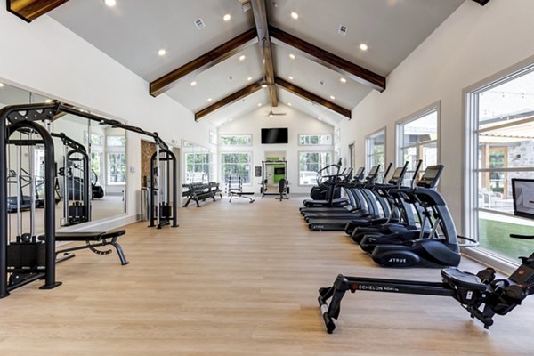 Fully-equipped fitness center with modern machines at Marion Lake Apartments, ideal for health-focused living