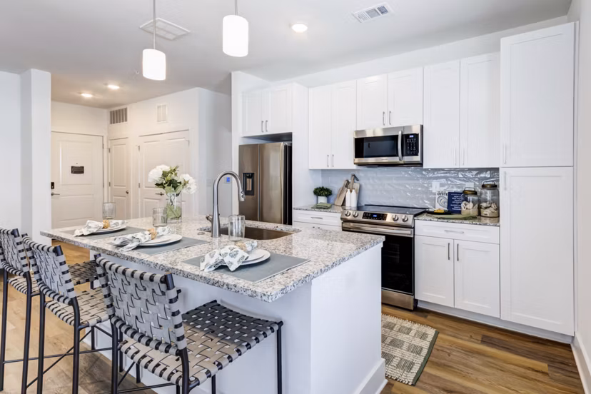 Modern kitchen with stainless steel appliances at Marion Lake Apartments: luxury living space in a premium Greystar community