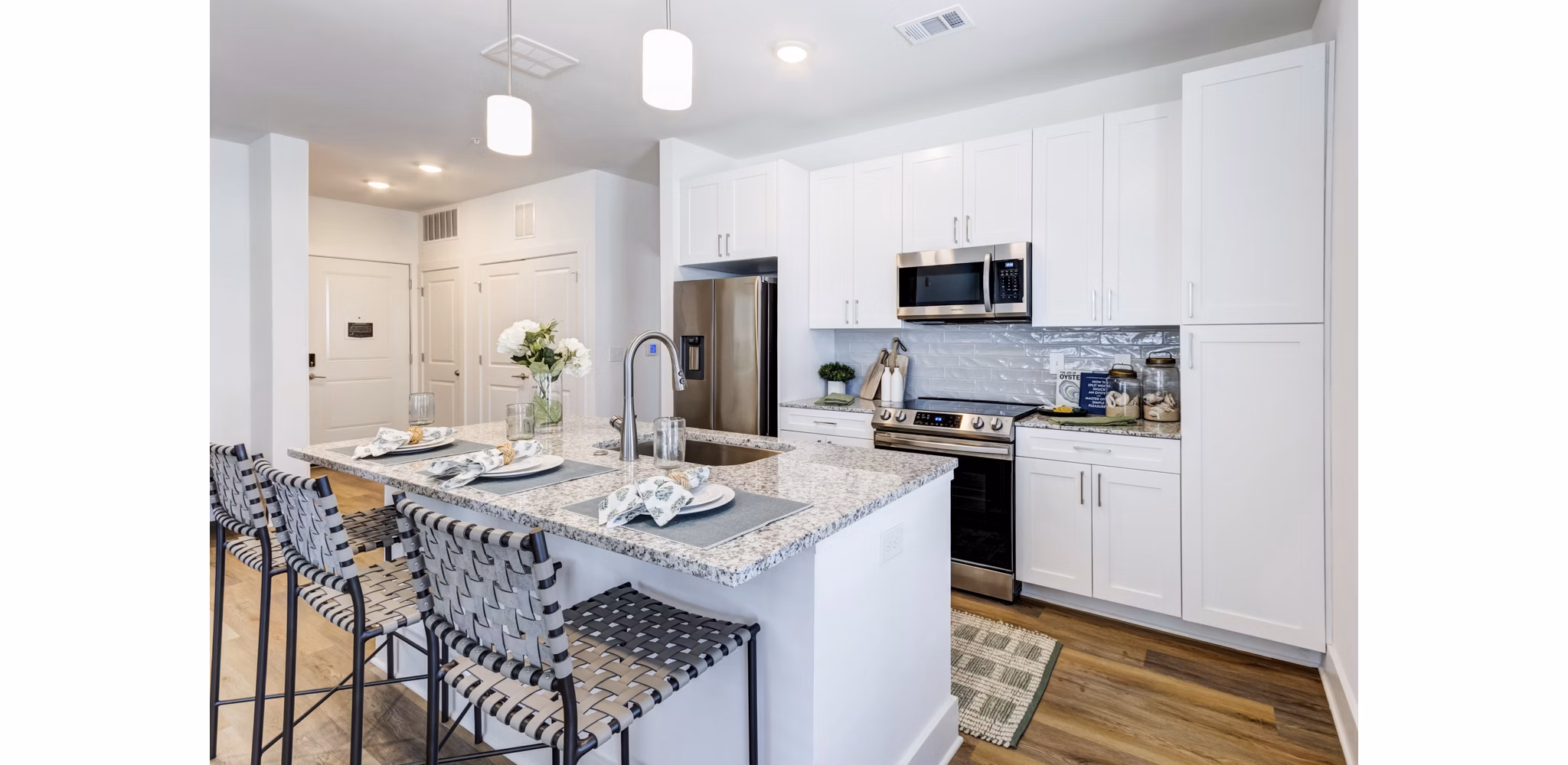 Modern kitchen with stainless steel appliances at Marion Lake Apartments: luxury living space in a premium Greystar community