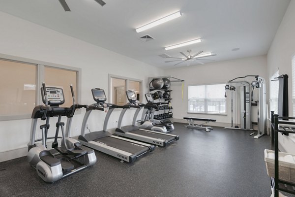 fitness center at The Grand at Carolina Forest Apartments