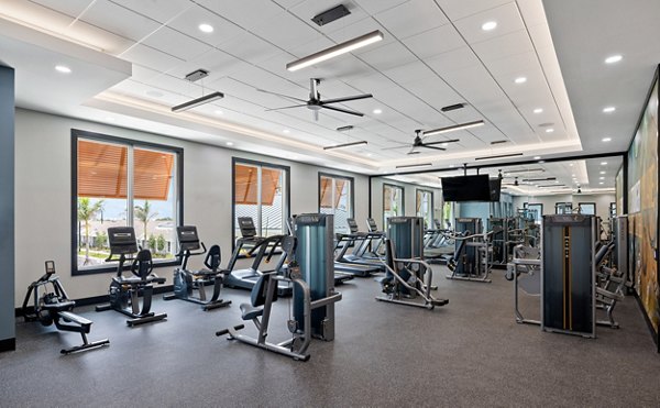 Premier fitness center with modern equipment at Encore at Tradition Apartments, a luxury community by Greystar