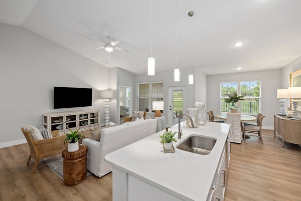 Modern kitchen with sleek countertops and stainless steel appliances at Encore at Tradition Apartments