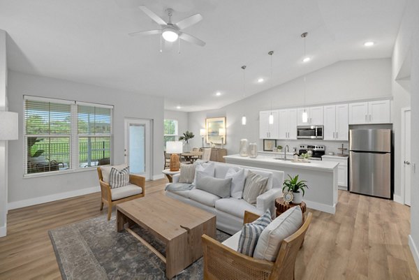 Spacious living room with modern furniture at Encore at Tradition Apartments