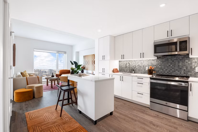 The Noble Apartments: Modern kitchen with stainless steel appliances and granite countertops