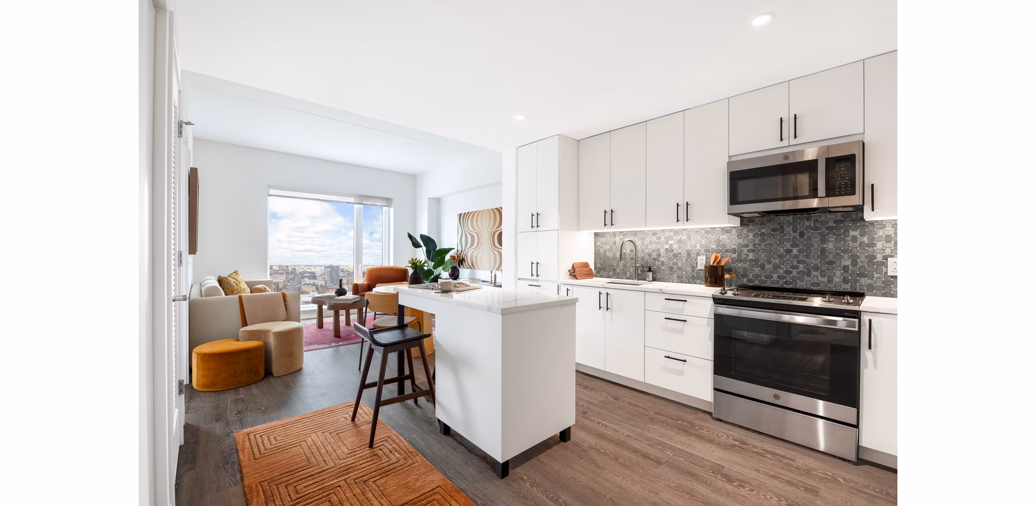 The Noble Apartments: Modern kitchen with stainless steel appliances and granite countertops