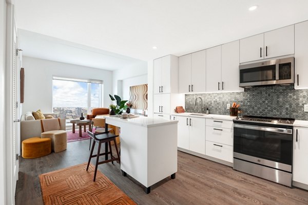 The Noble Apartments: Modern kitchen with stainless steel appliances and granite countertops