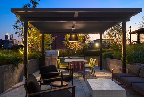 Modern grill area with sleek seating at The Noble Apartments, a luxury Greystar community in downtown Perfect for outdoor gatherings