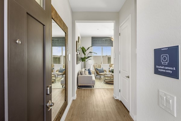 Corridor with elegant lighting and modern furnishings at Yardly Paradisi Homes luxury apartments