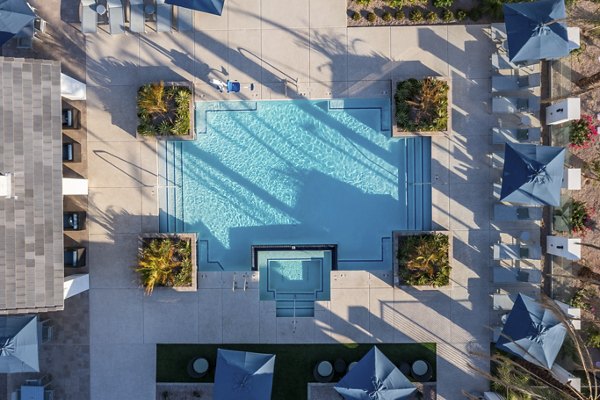 Resort-style pool with sundeck at Yardly Paradisi Homes, luxury apartments