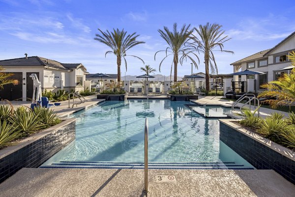 Luxurious pool area with sun loungers at Yardly Paradisi Homes, perfect for relaxation and leisure