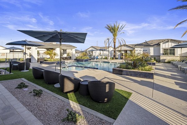 Luxury pool at Yardly Paradisi Homes surrounded by lush greenery and modern decor