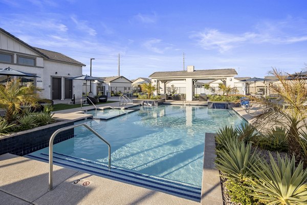 Resort-style outdoor pool at Yardly Paradisi Homes with luxurious lounging areas