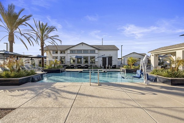 Luxurious pool with sun loungers at Yardly Paradisi Homes, perfect for relaxation and recreation