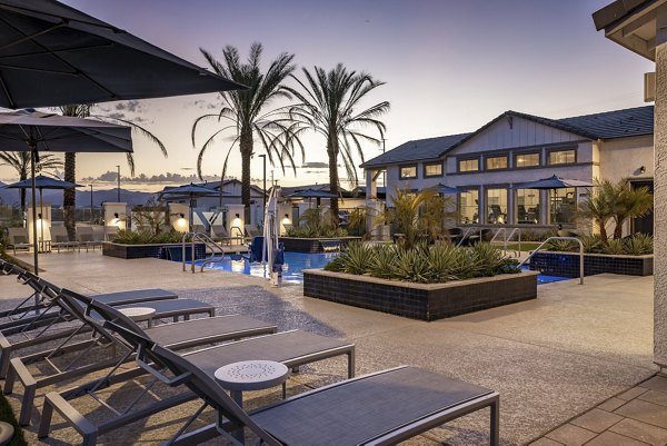 Relaxing outdoor pool area at Yardly Paradisi Homes, perfect for leisure and enjoyment