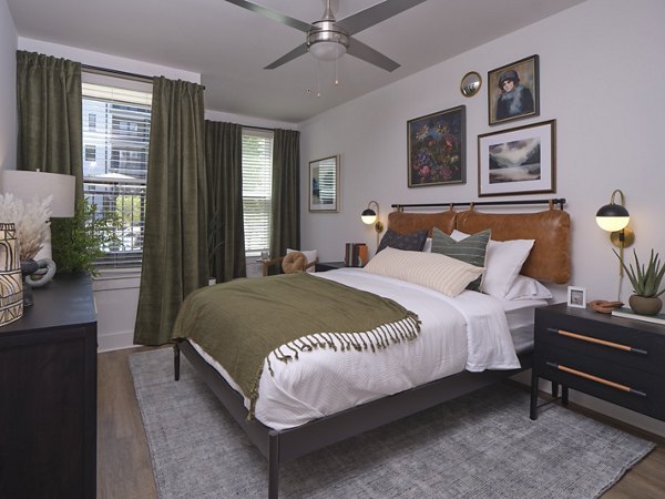 Luxurious bedroom with elegant furnishings at The Eden at Lakeview Apartments