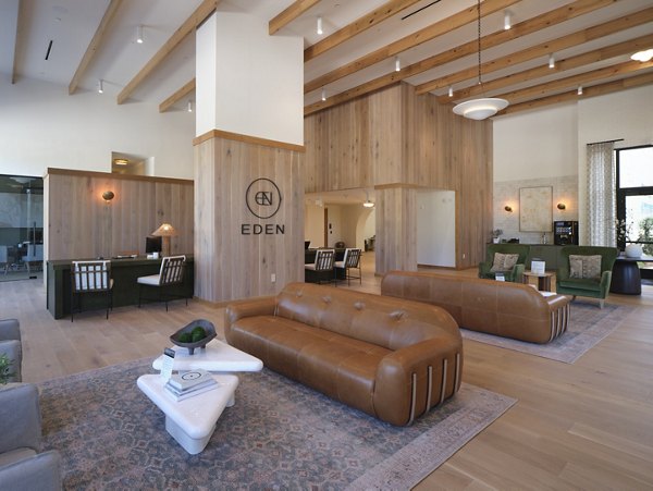 The Eden at Lakeview Apartments: Modern clubhouse featuring stylish decor and lounge seating for residents' enjoyment