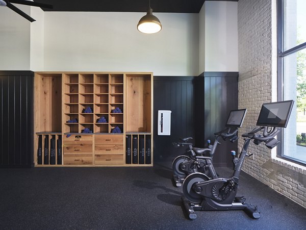 Fitness center with modern equipment at The Eden at Lakeview Apartments