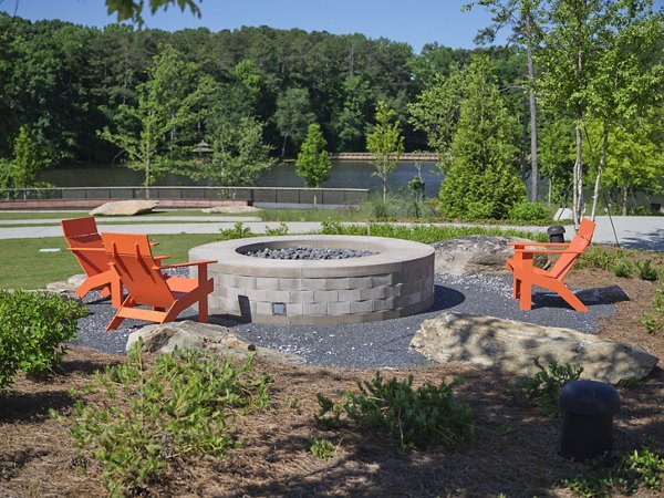 Fire pit lounge at The Eden at Lakeview Apartments offering cozy outdoor seating